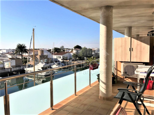 Apartment with canal views, community pool and parking