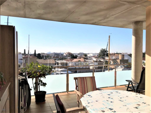 Apartment with canal views, community pool and parking