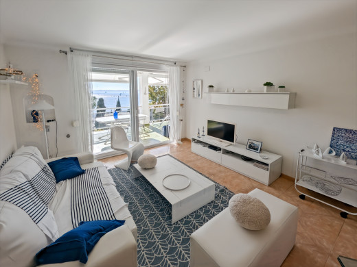 Apartment with sea views, large terrace, parking, and storage room – Canyelles Beach